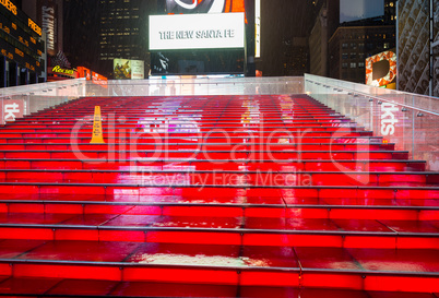 NEW YORK CITY - MAY 27: Wet red stairs of Duffy Square in Times
