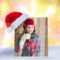 Composite image of brunette with cover holding mug and thinking