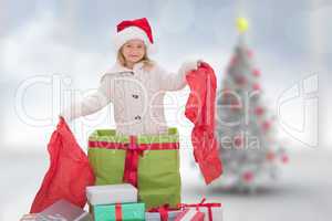 Composite image of cute girl in large gift