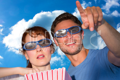 Composite image of couple enjoying a movie night