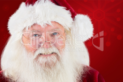 Composite image of santa smiling at camera