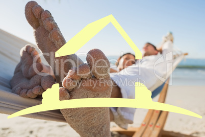 Composite image of close up of sandy feet of couple in a hammock
