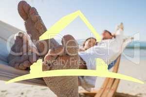 Composite image of close up of sandy feet of couple in a hammock