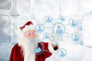 Composite image of santa claus pointing