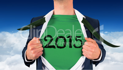 Composite image of businessman opening shirt in superhero style