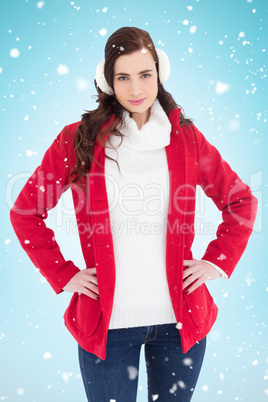 Composite image of smiling brunette posing with winter wear