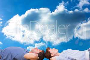 Composite image of couple lying on the floor