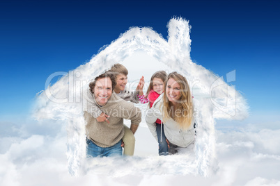 Composite image of happy couple piggybacking kids at beach