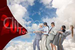 Composite image of business people pulling a rope