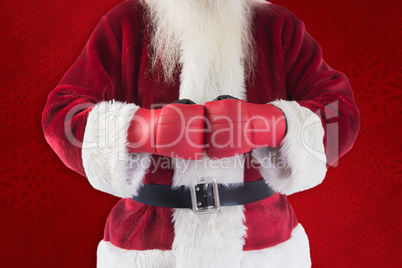 Composite image of santa claus wears boxing gloves