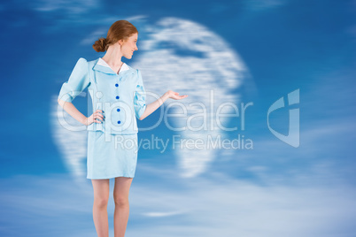 Composite image of pretty air hostess presenting with hand