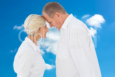 Composite image of angry older couple arguing with each other