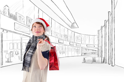 Composite image of smiling woman wearing santa hat