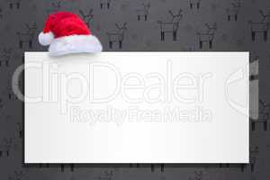 Composite image of santa hat on poster