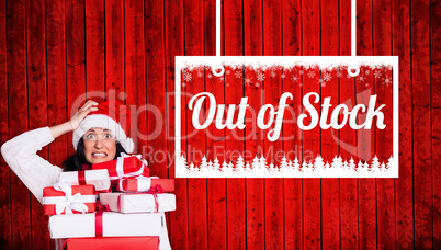 Composite image of shocked woman with christmas presents