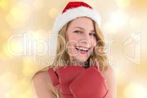 Composite image of smiling blonde wearing red boxing gloves