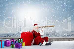 Composite image of santa looking through telescope