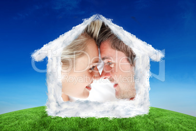 Composite image of close up of smiling couple looking at each ot