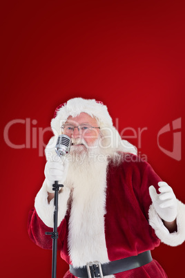 Composite image of santa claus is singing christmas songs