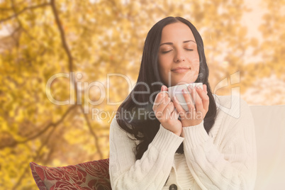 Composite image of woman enjoying a lovely drink