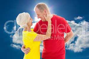 Composite image of happy mature couple hugging and smiling