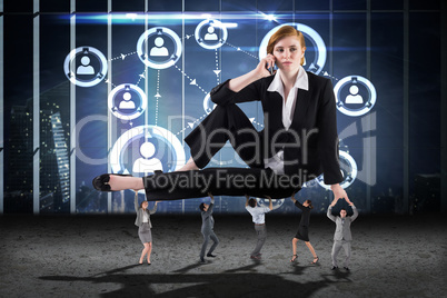 Composite image of business people supporting boss