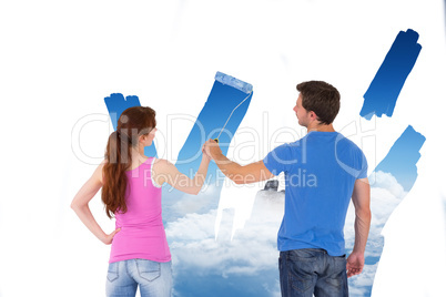 Composite image of couple painting together