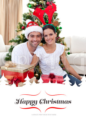 Composite image of happy couple celebrating christmas at home