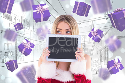 Composite image of pretty santa girl holding tablet