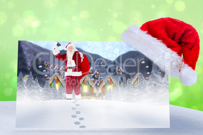 Composite image of santa delivery presents to village