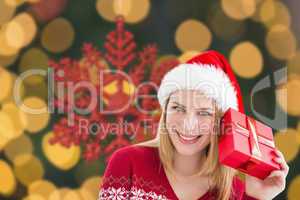 Composite image of woman checking her present