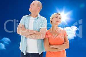 Composite image of thinking older couple with arms crossed