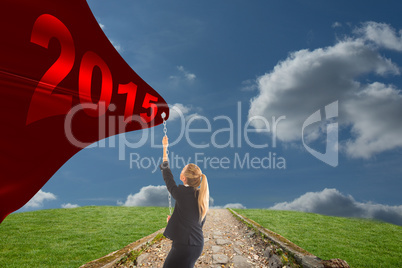 Composite image of businesswoman pulling a chain