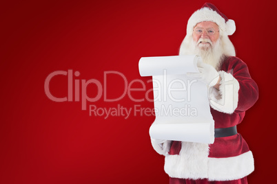 Composite image of father christmas holds a list