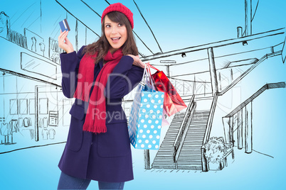 Composite image of brunette holding shopping bags and credit car