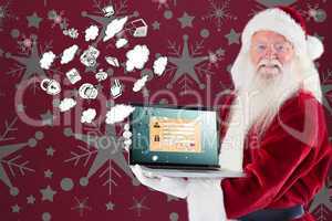 Composite image of santa claus presents a laptop