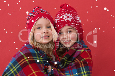 Composite image of festive little girls smiling at camera