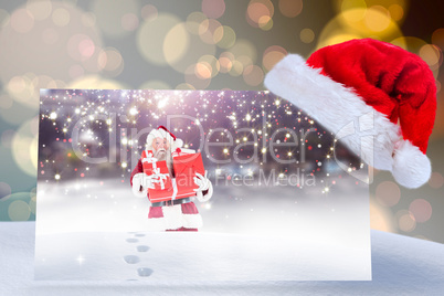 Composite image of santa hat on poster