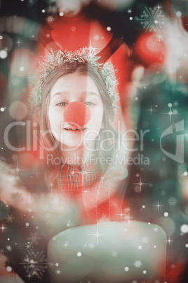 Composite image of festive little girl wearing red nose