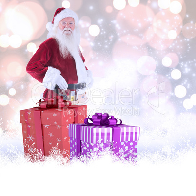 Composite image of father christmas is wearing a tool belt