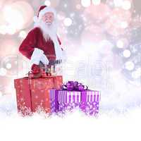 Composite image of father christmas is wearing a tool belt