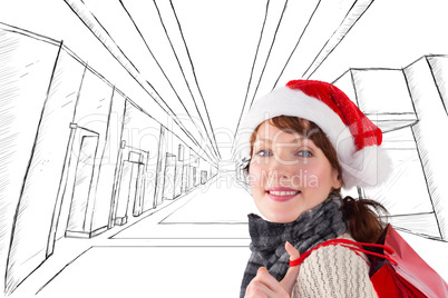 Composite image of smiling woman wearing santa hat