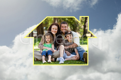 Composite image of happy family sitting in the garden