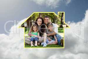 Composite image of happy family sitting in the garden