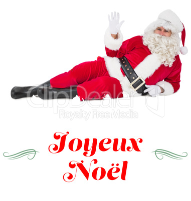 Composite image of relaxed santa lying and waving