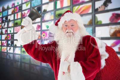 Composite image of happy santa ringing a bell