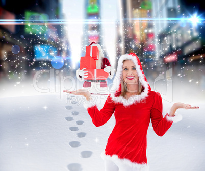 Composite image of festive blonde holding hands out