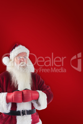 Composite image of santa claus wears boxing gloves