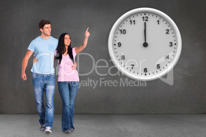 Composite image of young couple walking and pointing