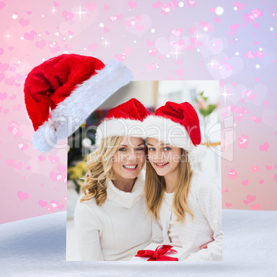 Composite image of festive mother and daughter smiling at camera